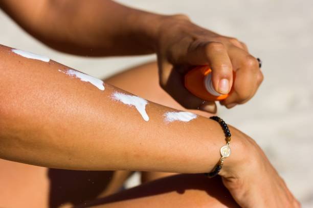 applying broad spectrum SPF 30 sunscreen for sun protection instead of tanning oil