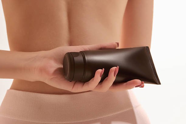 gradual tanning moisturizer applied daily as part of body care routine for bronze skin