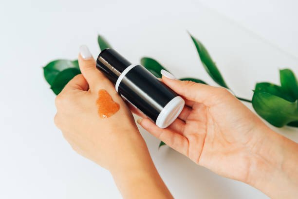 self tanning bronzing drops mixed into moisturizer for gradual bronze skin