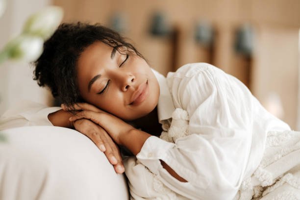 Young woman calmly relaxing after her skin Healthy glowing dark skin protected with daily sunscreen