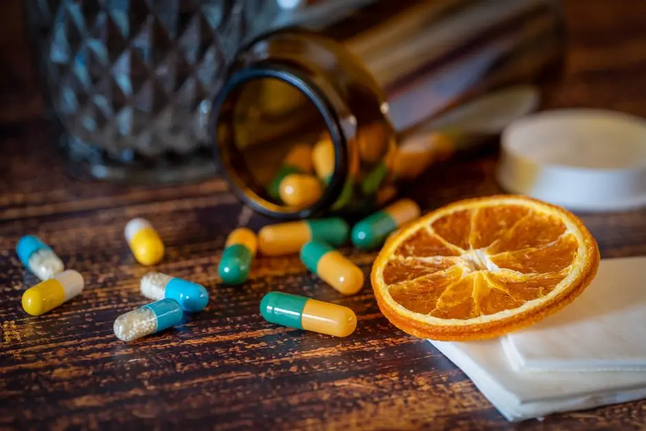 Close-up of vitamins, pills, and dried orange slice for cold relief. Best Vitamin B12 Supplements