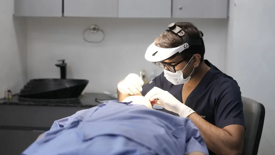 A dermatologist conducts a skin treatment on a patient Ways to Prevent Recurring and Treat Sunburns clinic setting.