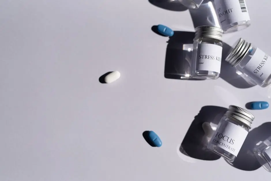 Flat lay of medicine bottles and pills on a white background, perfect for healthcare themes.