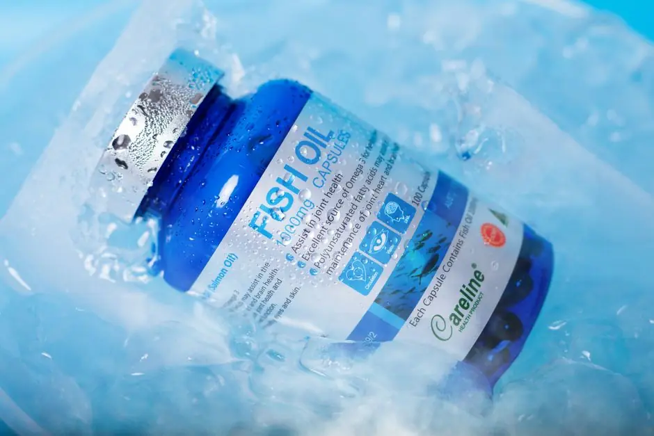 Blue bottle of fish oil capsules nestled in ice, emphasizing freshness and health benefits. Best Vitamins